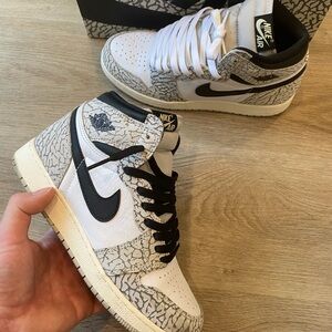- Jordan 1 Retro High OG White Cement